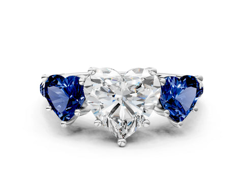 White gold Three-Stone Heart Cut Diamond Ring with Round with Blue Sapphire side stone Pavé Band and Prong Setting