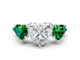 White gold Three-Stone Heart Cut Diamond Ring with Round with Emerald side stone Pavé Band and Prong Setting