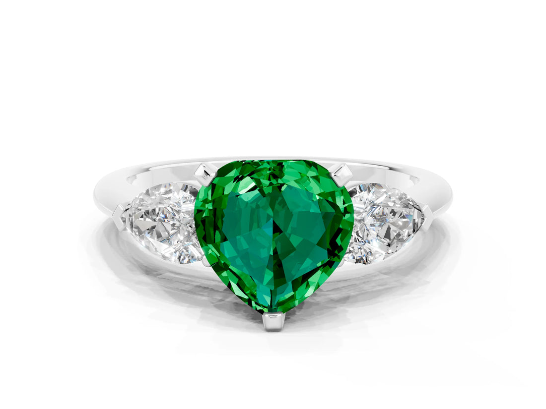White gold Three-Stone Heart Cut Emerald Ring with Pear Side Stones and Four-Prong Setting