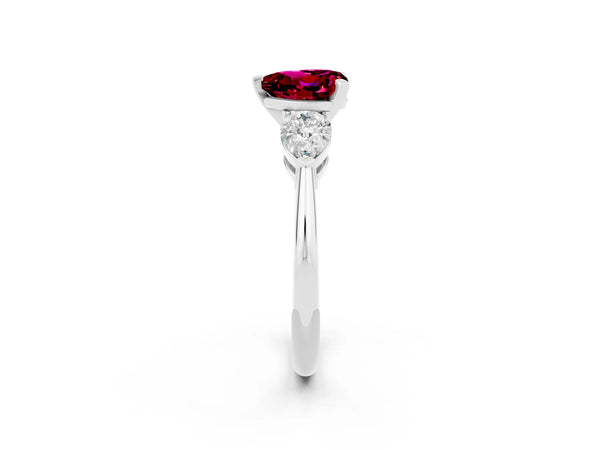 Platinum Three-Stone Heart Cut Garnet Ring with Pear Side Stones and Four-Prong Setting