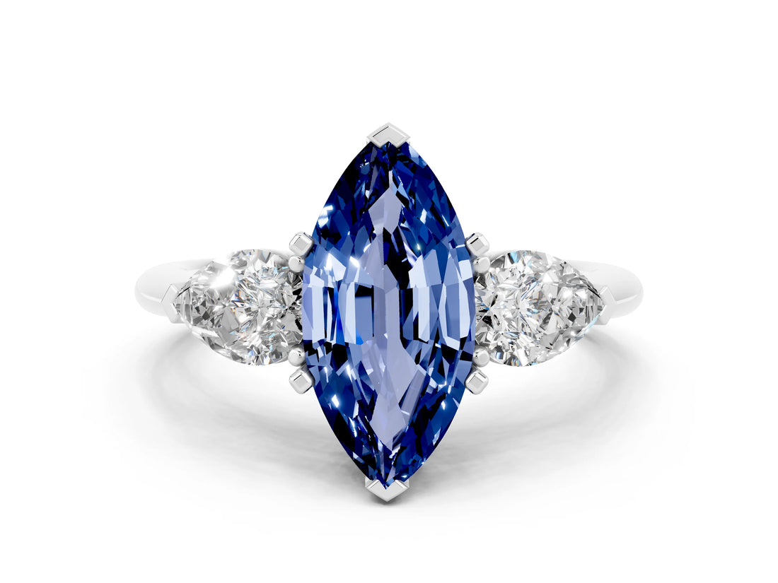 White gold Three-Stone Marquise Cut Blue Sapphire Ring with Pear Side Stones and Four-Prong Setting