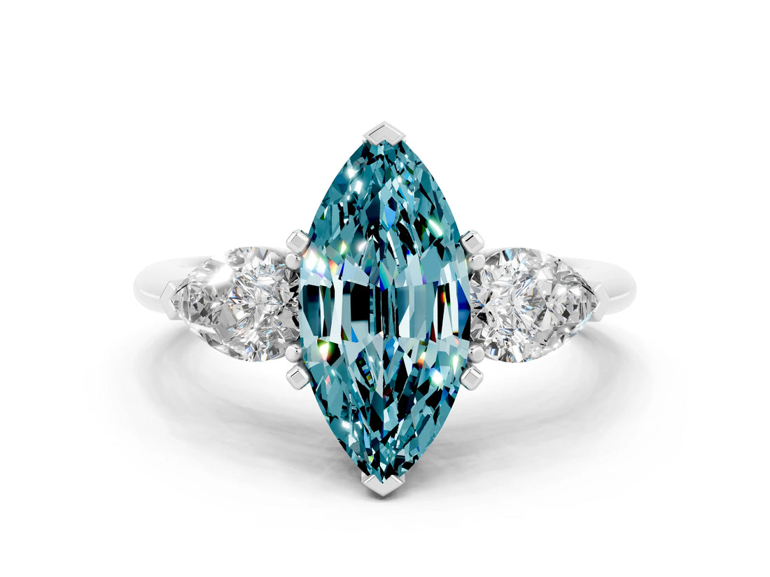 White gold Three-Stone Marquise Cut Blue Topaz Ring with Pear Side Stones and Four-Prong Setting