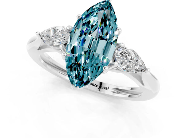 White gold Three-Stone Marquise Cut Blue Topaz Ring with Pear  Side Stones in Four-Prong Setting
