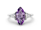 White gold Three-Stone Marquise Cut Cut Diamond Ring with Trillion Side Stones and Four-Prong Setting