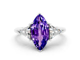White gold Three-Stone Marquise Cut Cut Diamond Ring with Trillion Side Stones and Four-Prong Setting