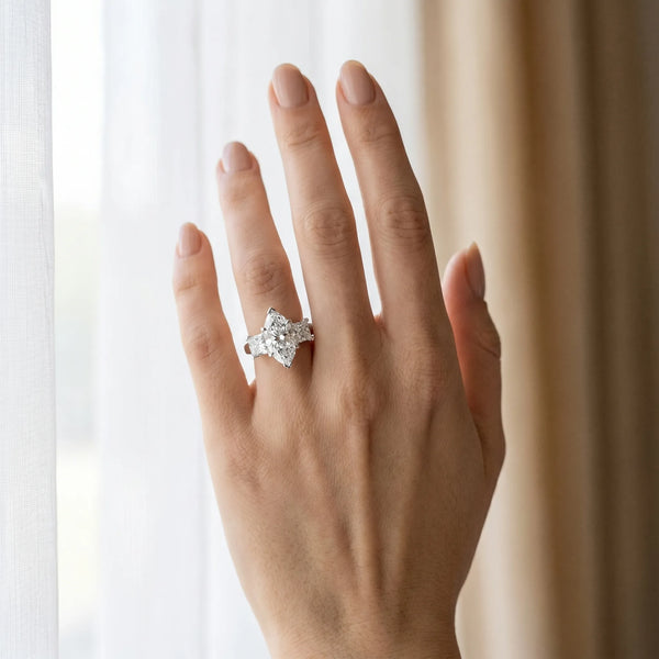 White gold Three-Stone Marquise Cut Diamond Ring with Channel Set Band and Four-Prong Setting