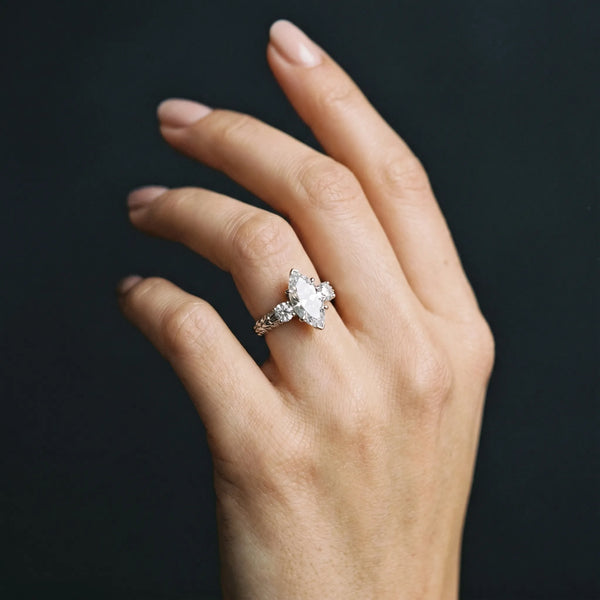 White gold Three-Stone Marquise Cut Diamond Ring with Channel-Set Band and Prong Setting