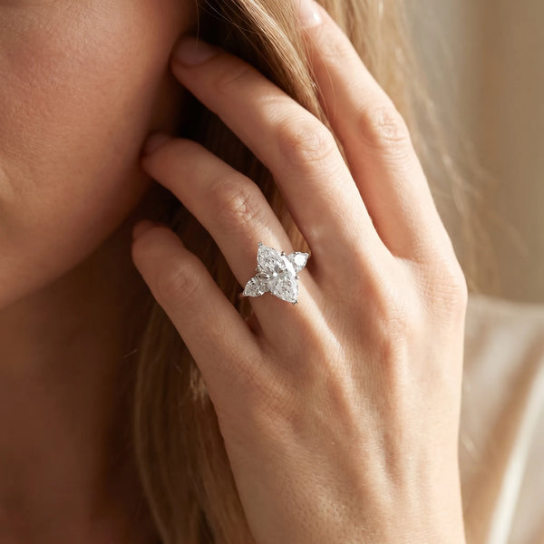 White gold Three-Stone Marquise Cut Diamond Ring with Pear Side Stones and Four-Prong Setting