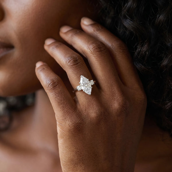 White gold Three-Stone Marquise Cut Diamond Solitaire with Prong Setting and Classic Band