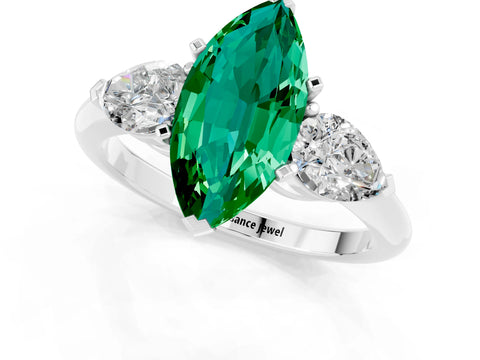 White gold Three-Stone Marquise Cut Emerald Ring with Pear Side Stones and Four-Prong Setting_1
