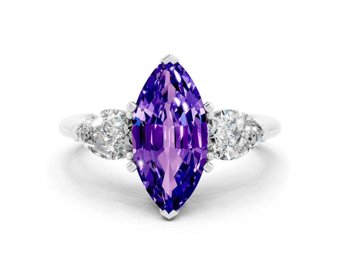 White gold Three-Stone Marquise Cut Tanzanite Ring with Pear Side Stones and Four-Prong Setting