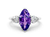 White gold Three-Stone Marquise Cut Tanzanite Ring with Pear Side Stones and Four-Prong Setting