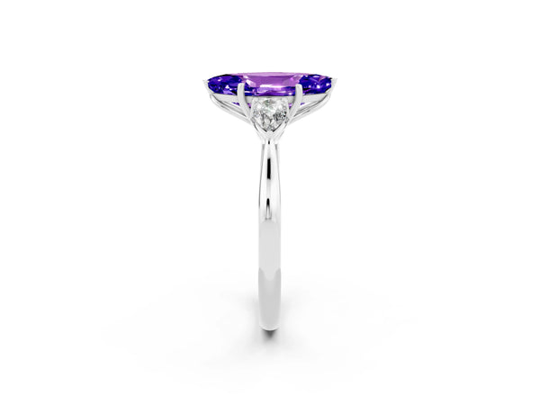 Platinum Three-Stone Marquise Cut Tanzanite Ring with Pear  Side Stones in Four-Prong Setting