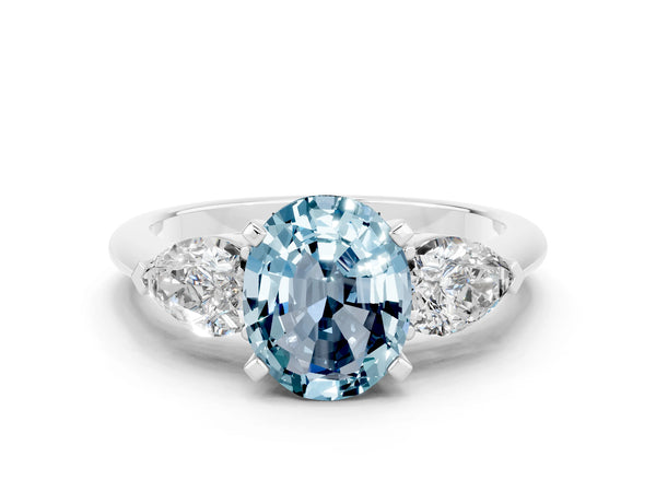 Platinum Three-Stone Oval Cut Aquamarine Ring with Pear Side Stones and Four-Prong Setting