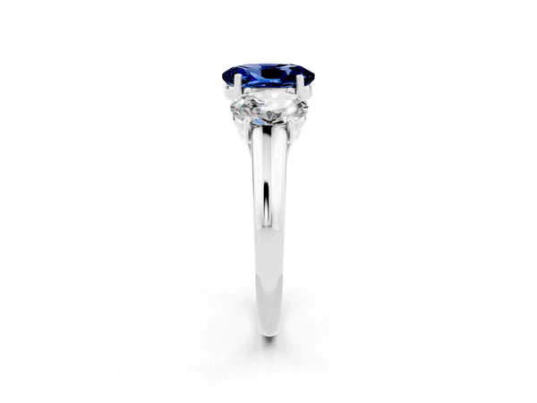 Platinum Three-Stone Oval Cut Blue Sapphire Engagement Ring with Prong Setting