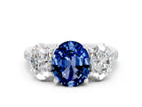 18K White Gold Three-Stone Blue Sapphire Ring with Round Pavé Band and Prong Setting