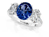 18K White Gold Three-Stone Blue Sapphire Ring with Round Pavé Band and Prong Setting