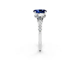 18K White Gold Three-Stone Blue Sapphire Ring with Round Pavé Band and Prong Setting