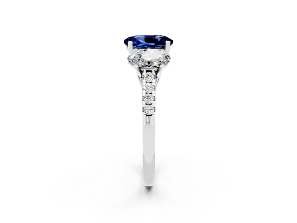 18K White Gold Three-Stone Blue Sapphire Ring with Round Pavé Band and Prong Setting