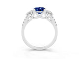 18K White Gold Three-Stone Blue Sapphire Ring with Round Pavé Band and Prong Setting