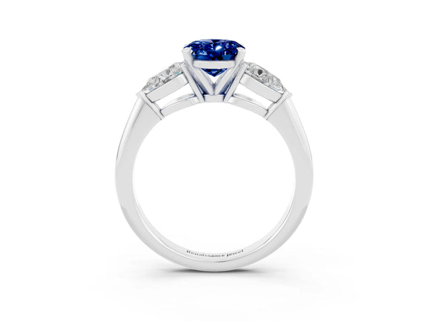 Platinum Three-Stone Oval Cut Blue Sapphire Ring with Pear Side Stones and Four-Prong Setting