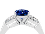 White gold Three-Stone Oval Cut Blue Sapphire Ring with Pear Side Stones and Four-Prong Setting_4