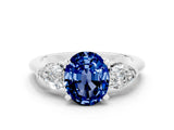 White gold Three-Stone Oval Cut Blue Sapphire Ring with Pear Side Stones and Four-Prong Setting
