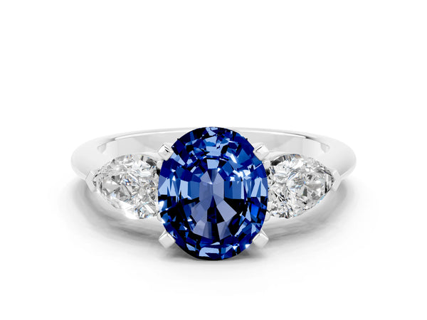 White gold Three-Stone Oval Cut Blue Sapphire Ring with Pear Side Stones and Four-Prong Setting