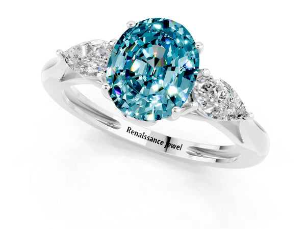 Silver Three-Stone Oval Cut Blue Topaz Ring with Pear  Side Stones in Four-Prong Setting