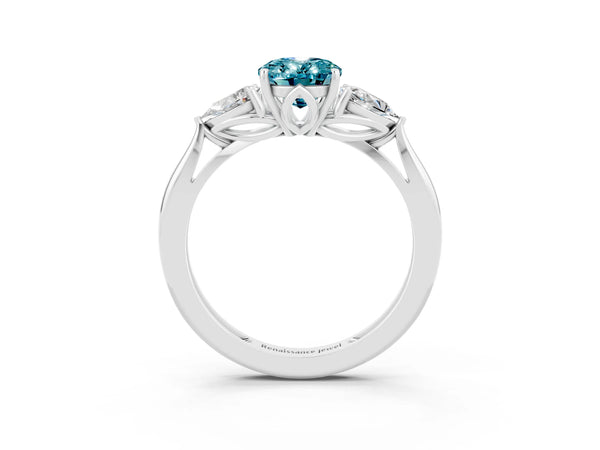 Platinum Three-Stone Oval Cut Blue Topaz Ring with Pear  Side Stones in Four-Prong Setting