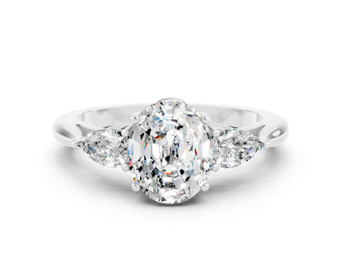 White gold Three-Stone Oval Cut Cut Diamond Ring with Pear Side Stones in Four-Prong Setting