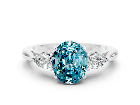 White gold Three-Stone Oval Cut Cut Diamond Ring with Pear Side Stones in Four-Prong Setting