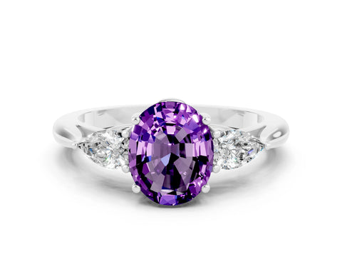 White gold Three-Stone Oval Cut Cut Diamond Ring with Pear Side Stones in Four-Prong Setting