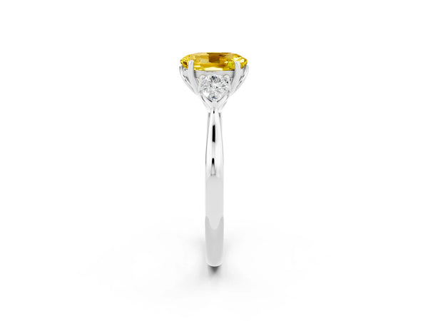Platinum Three-Stone Oval Cut Yellow Sapphire Ring with Pear  Side Stones in Four-Prong Setting