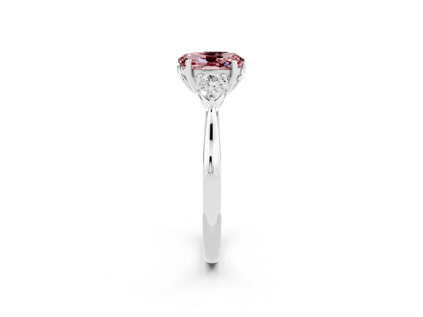 Platinum Three-Stone Oval Cut Cut Diamond Ring with Pear Side Stones in Four-Prong Setting