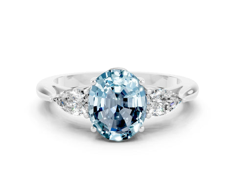 White gold Three-Stone Oval Cut Cut Diamond Ring with Pear Side Stones in Four-Prong Setting