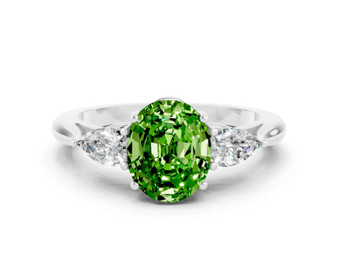 White gold Three-Stone Oval Cut Cut Diamond Ring with Pear Side Stones in Four-Prong Setting