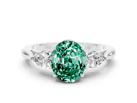 White gold Three-Stone Oval Cut Cut Diamond Ring with Pear Side Stones in Four-Prong Setting