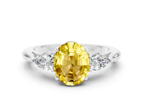 White gold Three-Stone Oval Cut Cut Diamond Ring with Pear Side Stones in Four-Prong Setting