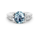 White gold Three-Stone Oval Cut Cut Diamond Ring with Trillion Side Stones and Four-Prong Setting