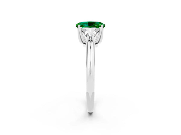 Silver Three-Stone Oval Cut Emerald Engagement Ring with Trillion Side Stones and Prong Setting