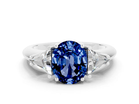 White gold Three-Stone Oval Cut Cut Diamond Ring with Trillion Side Stones and Four-Prong Setting