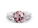 White gold Three-Stone Oval Cut Cut Diamond Ring with Trillion Side Stones and Four-Prong Setting