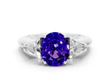 White gold Three-Stone Oval Cut Cut Diamond Ring with Trillion Side Stones and Four-Prong Setting