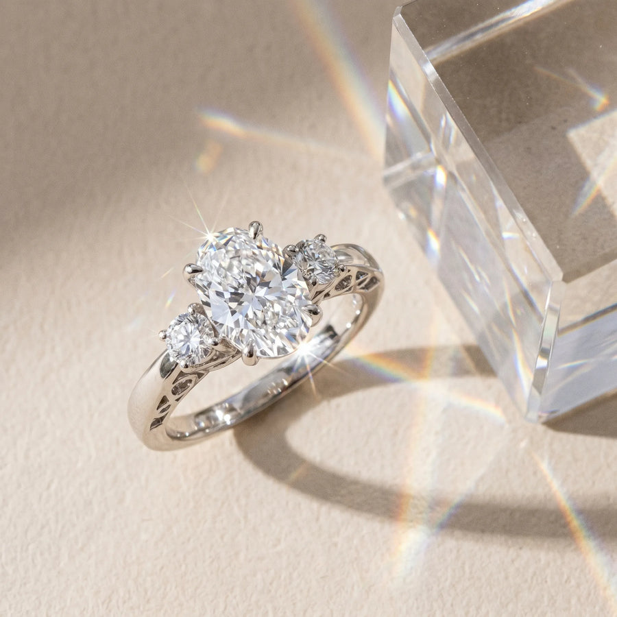 White gold Three-Stone Oval Cut Diamond Cathedral Engagement Ring with Prong Setting