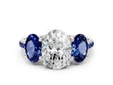 White gold Three-Stone Oval Cut Diamond Ring with Round with Blue Sapphire side stone Pavé Band and Prong Setting_12