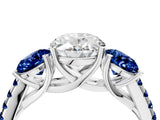 White gold Three-Stone Oval Cut Diamond Ring with Round with Blue Sapphire side stone Pavé Band and Prong Setting_16