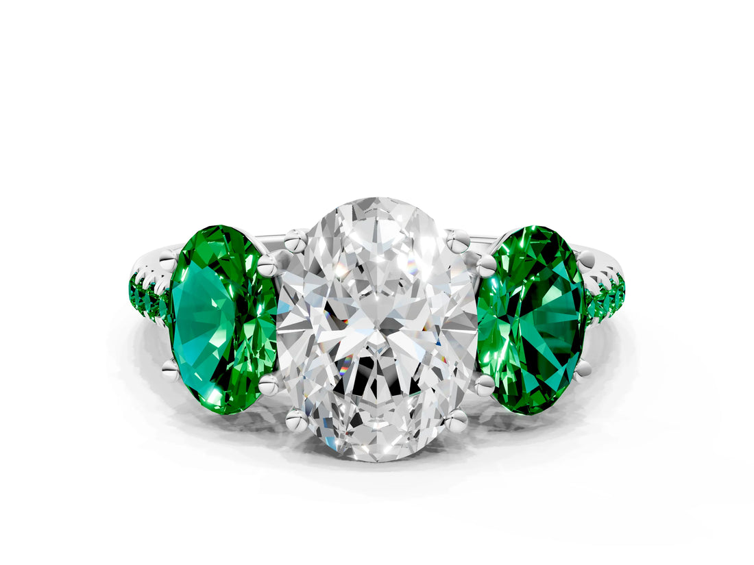 White gold Three-Stone Oval Cut Diamond Ring with Round with Emerald side stone Pavé Band and Prong Setting
