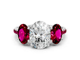 White gold Three-Stone Oval Cut Diamond Ring with Round with Garnet side stone Pavé Band and Prong Setting