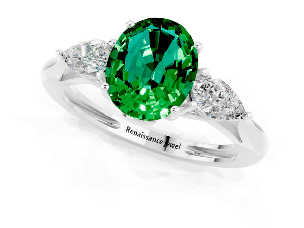 Platinum Three-Stone Oval Cut Emerald Ring with Pear  Side Stones in Four-Prong Setting
